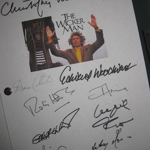 May include: A white sheet of paper with multiple signatures from the cast and crew of the film "The Wicker Man". The signatures include Christopher Lee,  Robin  Hawdon,  Britt Ekland,  and  Edward Woodward.