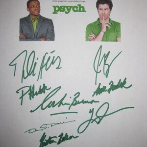 May include: A promotional poster for the TV show "Psych" featuring two actors, the show's title, and the tagline "fake psychic. real detectives." The poster is signed in green ink.