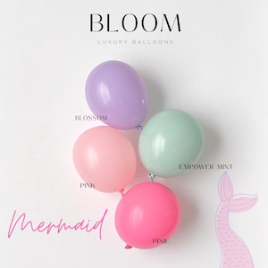 May include: Four pastel colored balloons with the text "BLOOM LUXURY BALLOONS" at the top of the image. The balloons are labeled "BLOSSOM", "PINK", "EMPOWER MINT", and "PIXIE". The text "mermaid" is written in pink cursive at the bottom of the image.