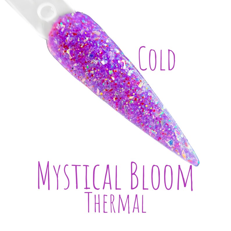 May include: A nail swatch displays a vibrant purple glitter nail polish. The polish is labeled "Mystical Bloom Thermal" and "Cold". The glitter is a mix of iridescent and colorful flakes, creating a shimmering effect. The nail polish is on a white background.