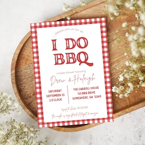 May include: A red and white checkered invitation card with the text "I DO BBQ" in red. The invitation is for a couples shower honoring Drew and Haleigh. The event is scheduled for Saturday, September 23 at 2 o'clock at The Carroll House, 123 BBQ Drive, Somewhere, GA 12345.