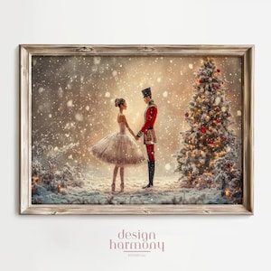 May include: A framed print depicts a winter scene with a ballerina and a soldier holding hands near a decorated Christmas tree. The ballerina wears a white tutu, and the soldier is in a red uniform. Snow falls around them, creating a festive holiday atmosphere.