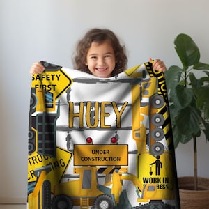 Custom Personalized Kids Name Blanket, Big Construction Trucks on a toddler blanket.  Three Sizes of customizable blankets for children.