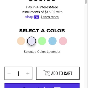 May include: A lavender hoodie with the text "CLOUD HOODIE" and a price of £60.00. The hoodie is available in four colours: beige, lavender, light green, light blue, and pink. The text "SELECT A COLOR" is displayed above the colour options. The text "Selected Colour: Lavender" is displayed below the colour options. The text "Pay in 4 interest-free installments of £15.00 with shop Pay Learn more" is displayed below the price. The text "ADD TO CART" is displayed on a button with a shopping cart icon. The text "Buy with shop Pay" is displayed on a purple button. The text "Secure Checkout", "Money-Back Guarantee", and "Fast Shipping" is displayed on three buttons below the "Buy with shop Pay" button.