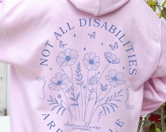 May include: Pink hoodie with a blue graphic print on the back that says "Not all disabilities are visible" with a floral design and butterflies.