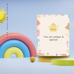 May include: A yellow teapot with a floral design on a light pink background with a variety of colorful illustrations. The text "You are unique & special." is printed below the teapot.