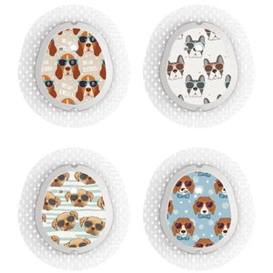 May include: Four round adhesive bandages with different dog-themed patterns. The patterns include dogs wearing sunglasses, dogs with stripes, and dogs with polka dots.