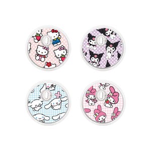 May include: Four round, white objects with colorful cartoon character designs. Each has a different pattern and character, including Hello Kitty, My Melody, and Kuromi, on a pink, purple, blue, and pink background. The objects are likely decorative or functional.