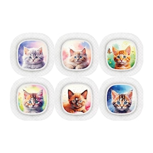 May include: Six white ceramic coasters with colourful watercolour images of kittens. Each coaster features a different kitten with a unique background.