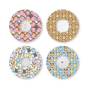 May include: Four circular adhesive patches for medical devices, each featuring a repeating pixel-art pattern of various Eevee evolution characters. The designs include pink, tan, checkered, and blue backgrounds with small, colorful creature illustrations.