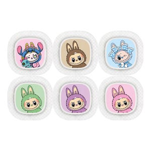 May include: Six colorful cartoon character stickers. Each sticker features a bunny-like creature in different outfits and colors, including blue, brown, green, purple, and pink. The stickers are set against a white background with a textured border.