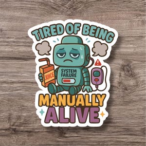 Può includere: Adesivo con un robot verde acqua abbattuto con la scritta "Tired of Being Manually Alive". Il robot tiene in mano un cartone di succo e ha un messaggio "System Failure" sul petto. Lo stile è a cartone animato.