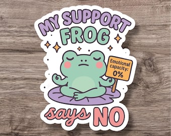 May include: A sticker featuring a cartoon frog in a meditative pose on a purple lily pad. The text "MY SUPPORT FROG says NO" is in a bubble around the frog. The frog holds a sign that reads "Emotional capacity: 0%."