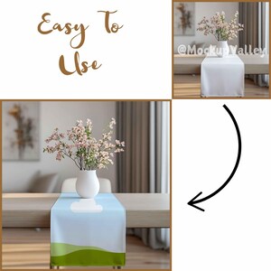 May include: A light blue table runner with a white cloud and green grass design. The runner is on a wooden table with a white vase and pink flowers.