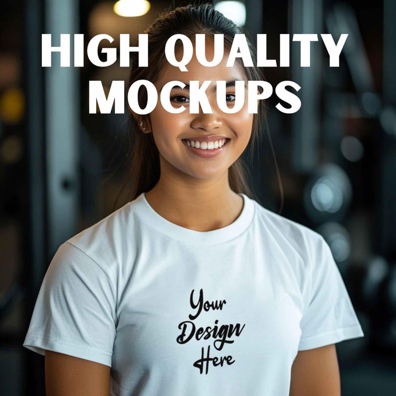 May include: A white t-shirt mockup with the text "Your Design Here" printed on the front. The t-shirt is being worn by a person with a smiling face.