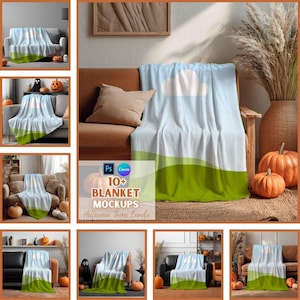 May include: A white blanket with a blue sky and cloud design, and a green landscape border. The blanket is draped over a sofa. The image also includes pumpkins and the text "10+ BLANKET MOCKUPS Halloween Theme Bundle".
