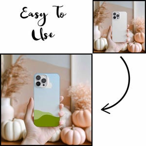 May include: A light blue and green phone case with a landscape design. The case features a cloud and rolling hills graphic. The text "Easy To Use" is written in black script. The phone case is held in a person's hand.