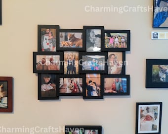 May include: A collage of black picture frames with various photos of people and pets. The frames are arranged in a heart shape on a white wall.