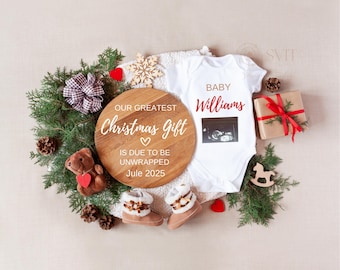 May include: A festive Christmas-themed announcement. A white onesie with a sonogram image and the name "Williams" is surrounded by greenery, a wooden sign reading "Our Greatest Christmas Gift," baby booties, and a wrapped gift.