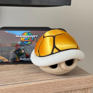 Concha dorada inspirada en Mario Kart World