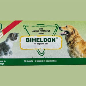 May include: A green, red and white box of Biheldon tablets for dogs and cats. The box features a cat and a dog on the front, along with the text "30 tablets - 3 blisters in a carton box".