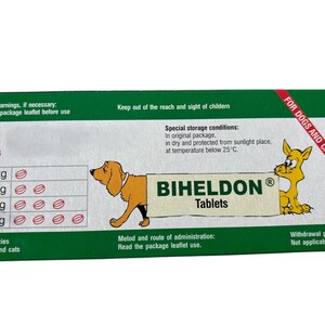 May include: Green and white box with the text "BIHELDON Tablets" and a dosage chart for dogs and cats. The box also includes the text "For Dogs and Cats" and "Special storage conditions: In original package, in dry and protected from sunlight place, at temperature below 25&deg;C."