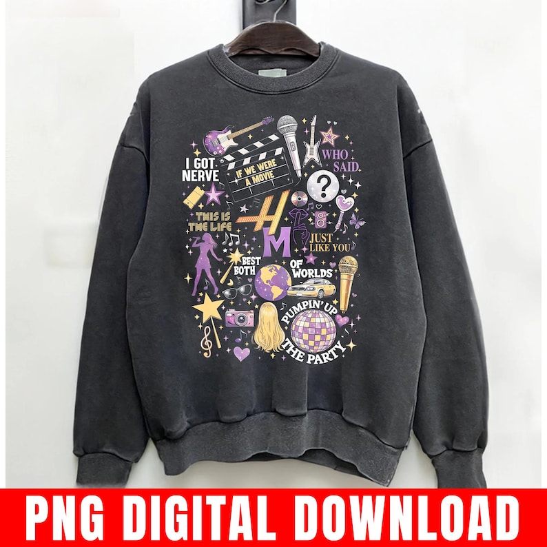 Pode incluir: Camisola cinza escuro com um design gr&aacute;fico com instrumentos musicais, uma claquete de filme e o texto "I Got Nerve", "If We Were a Movie" e "Pumpin' Up The Party". O design inclui detalhes em roxo e dourado.