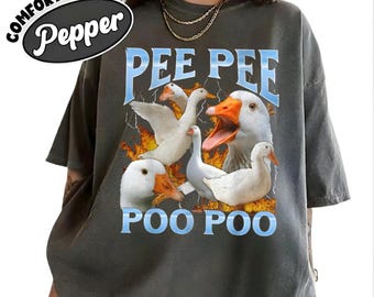May include: Dark grey Comfort Colors t-shirt with a graphic of white geese and the words "PEE PEE POO POO" in blue. The shirt has a distressed look and the word "Pepper" is in a black oval.