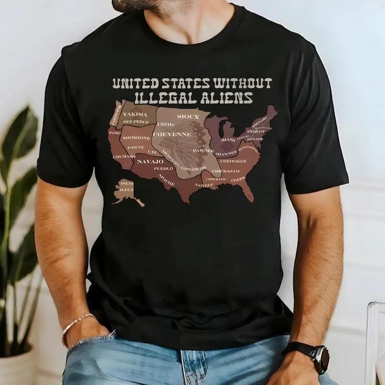 May include: Black t-shirt with the text "UNITED STATES WITHOUT ILLEGAL ALIENS" above a map of the United States. The map is colored in shades of brown and tan, with various tribal names printed on it.