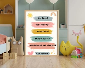 May include: A framed print with the words "I AM BRAVE, CONFIDENT, CREATIVE, THOUGHTFUL, GROWING AND LEARNING, ENOUGH" in a colorful design. The print has a light wood frame and is decorated with a sun, rainbow, heart, and stars.