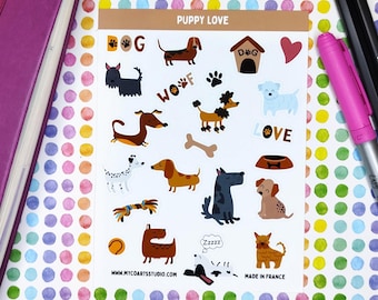 May include: A sticker sheet featuring various dog illustrations and related icons. The stickers include different breeds of dogs, paw prints, and bones. The text "Puppy Love" and "Woof" are also present. The background is a colorful polka dot pattern.