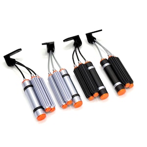 May include: Four automotive shock absorber reservoirs with mounting brackets. Two units are silver with black bands and orange end caps, and two are black with silver bands and orange end caps. Each features dual cylindrical bodies and cables.