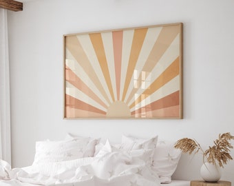 May include: A white bed with a white duvet cover and white pillowcases featuring a subtle star pattern. The bed is made with a wooden frame and has a white rug underneath. A large framed print of a sunset with orange, yellow, and pink hues hangs on the wall behind the bed.