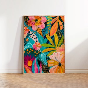 May include: A framed print featuring a colourful abstract floral design with pink, yellow, orange, and blue flowers and leaves on a dark background.