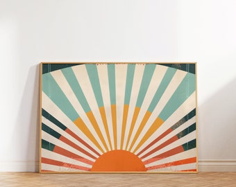 May include: A framed print with a retro sunburst design in shades of orange, yellow, blue, and red. The sunburst is centered in the print and has a textured background.