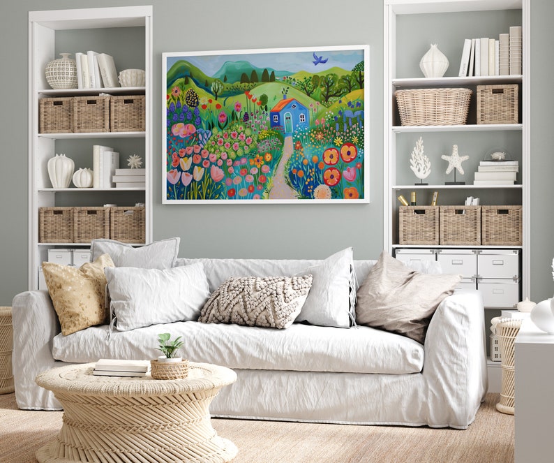 May include: A painting of a blue house in a field of colorful flowers. The house has a white door and a white roof. There are green hills in the background and a blue bird flying in the sky.