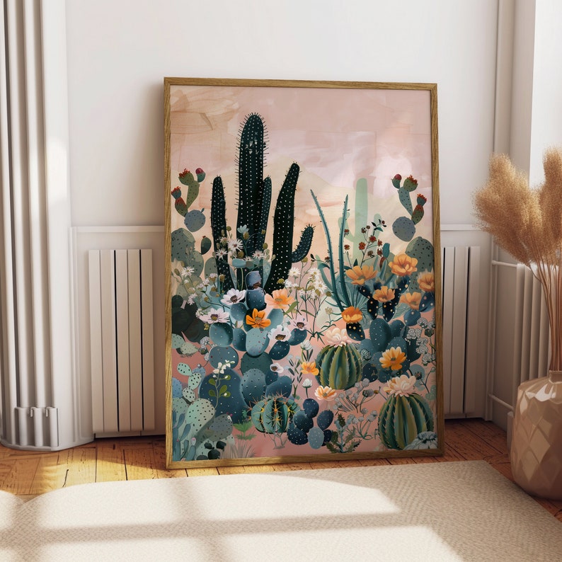 Pu&ograve; includere: Un'illustrazione incorniciata di un paesaggio desertico con cactus, piante grasse e fiori in tonalit&agrave; di verde, rosa e giallo. Lo sfondo &egrave; di un rosa tenue.