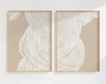 May include: Two framed prints with a beige background and white abstract line art. The line art is in the shape of a swirl or wave.