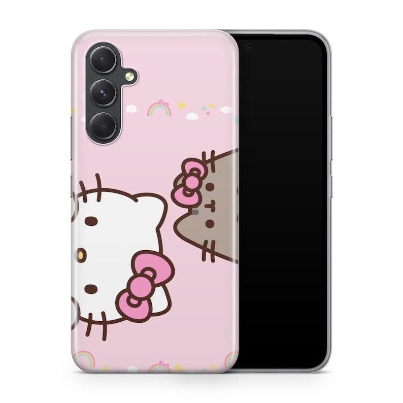 May include: A pink phone case with a Hello Kitty and Pusheen character design. The case has a cutout for a camera lens and a rainbow pattern.
