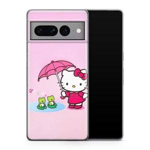 May include: A pink phone case with a cartoon Hello Kitty design holding a pink umbrella. Two green frogs sit on lily pads in a pond. Musical notes float. The case is on a black smartphone.