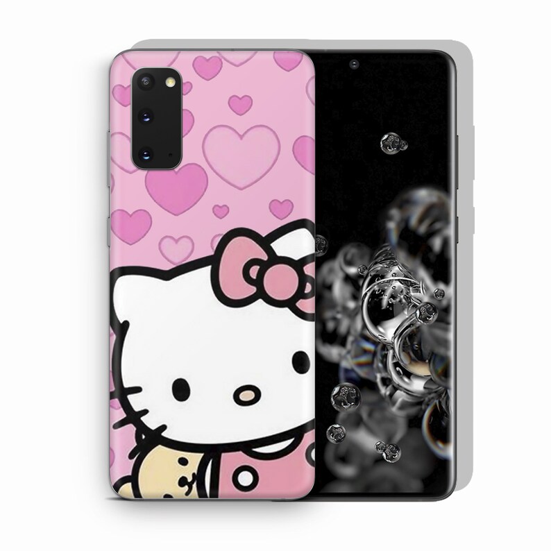 May include: Pink phone case featuring a Hello Kitty design with a pink bow and hearts. The case is on a smartphone with a black screen. The background is white.