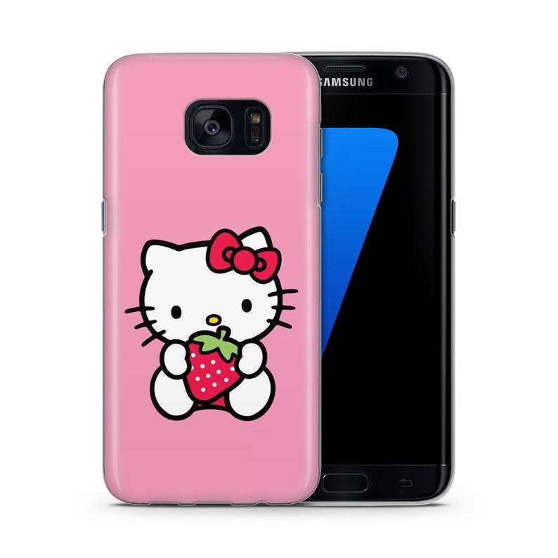 May include: Pink phone case featuring a Hello Kitty design. Hello Kitty is holding a red strawberry. The case is compatible with Samsung Galaxy phones.