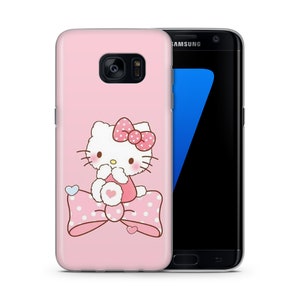 May include: A pink phone case featuring a Hello Kitty design. Hello Kitty is sitting on a pink and white polka dot bow. The phone case is compatible with Samsung Galaxy S7 Edge.