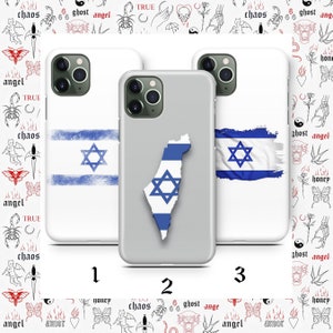 May include: Three white iPhone cases with different designs featuring the Israeli flag. The first case has a faded blue and white Israeli flag with a six-pointed star. The second case has a gray background with a white outline of the country of Israel filled with the Israeli flag. The third case has a faded blue and white Israeli flag with a six-pointed star.