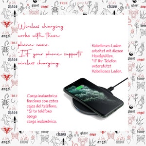 May include: A black wireless charging pad with a white iPhone on top of it. The image is surrounded by a black and white pattern with the words "chaos", "ghost", "angel", and "honey" repeated throughout. The text "Wireless charging works with these phone cases. *If your phone supports wireless charging." is written in red on the left side of the image. The text "Kabelloses Laden arbeitet mit diesen Handyh&uuml;llen. *IF Ihr Telefon unterst&uuml;tzt Kabelloses Laden." is written in red on the right side of the image. The text "Carga inalambrica funciona con estos cajas del tel&eacute;fono. *SI tu tel&eacute;fono apoya carga inalambrica." is written in red on the bottom left side of the image.