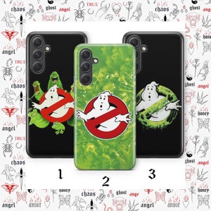May include: Three different phone cases featuring a green and white Ghostbusters logo. The first case is black with a green and white Ghostbusters logo. The second case is green with a white Ghostbusters logo. The third case is black with a green and white Ghostbusters logo.