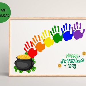 May include: A printable St. Patrick's Day craft for kids. The image shows a rainbow made of handprints in red, orange, yellow, green, blue, and purple. The rainbow is over a pot of gold with shamrocks.