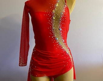 May include: Red dance leotard with a sheer mesh overlay and a single long sleeve. The leotard is decorated with rhinestones in a diagonal pattern.
