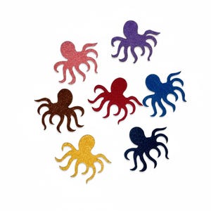 Peut inclure: Un ensemble de sept découpes en forme de pieuvre avec une finition pailletée. Le lot comprend des pieuvres individuelles dans des tons rose, violet, marron, rouge, bleu, jaune et bleu marine foncé, chacune dotée de huit tentacules courbés.
