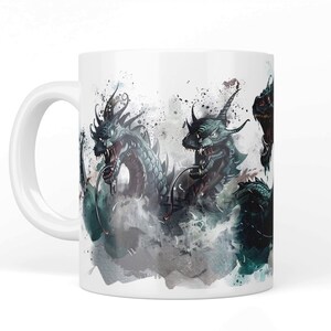 May include: White ceramic mug featuring a detailed illustration of several dragons in shades of teal, gray, and red. The dragon artwork is set against a backdrop of gray and black splatters, creating a fantasy theme.
